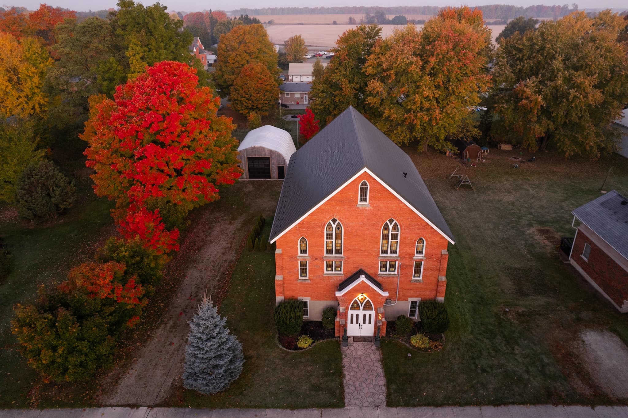 Mike’s Church, a converted brick church, aerial view in fall colour