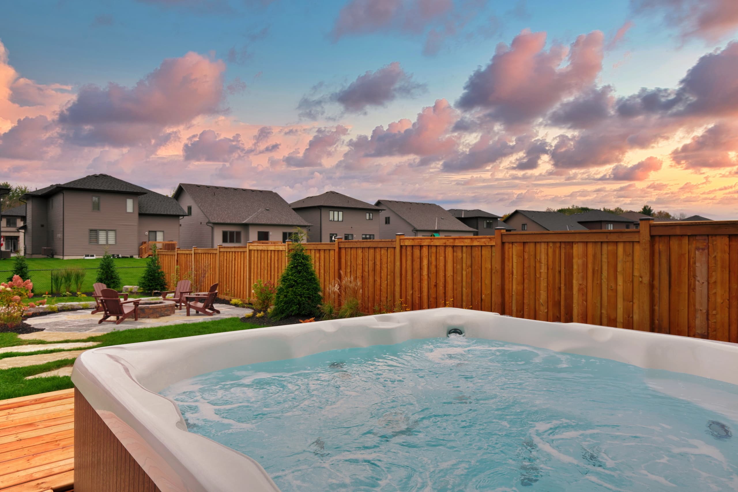 Owen’s House backyard deck and hot tub at dusk